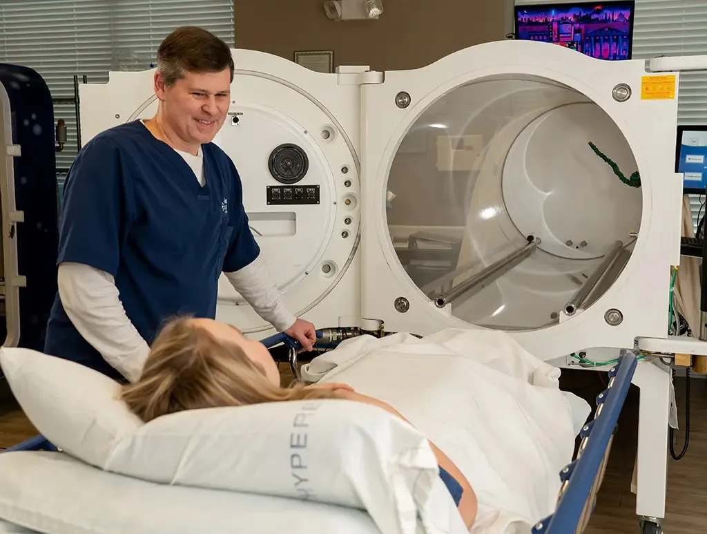 Clinical multiplace hyperbaric chamber with seating for multiple occupants.